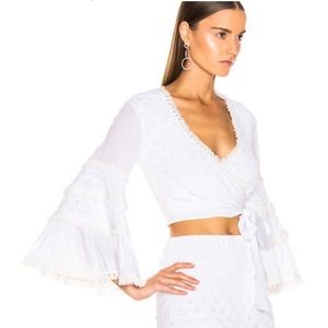 Alexis "Godiva" textured knit top.
V neckline; self-tie closure.